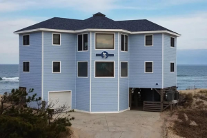 blog-post-rental-exterior-link-pelican | Swack Vacations Oceanfront beach house vacation rental exterior during daytime