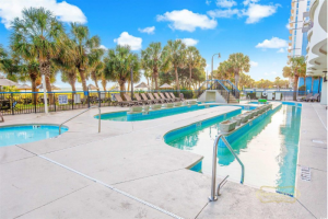 Beach resort community with shared pools and amenities