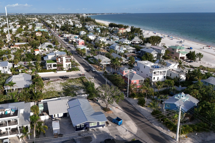 Beach vacation rentals lined along the coastline