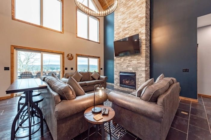 Open living room with fireplace in a winter vacation rental