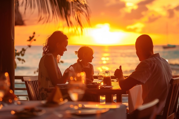 Family enjoying private balcony overlooking the ocean