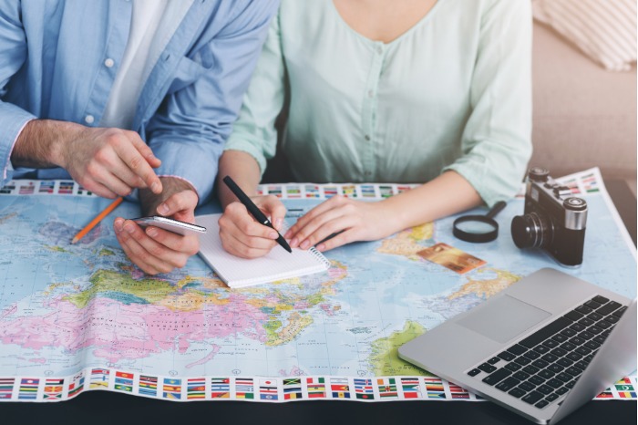 Family discussing vacation plans together at a table