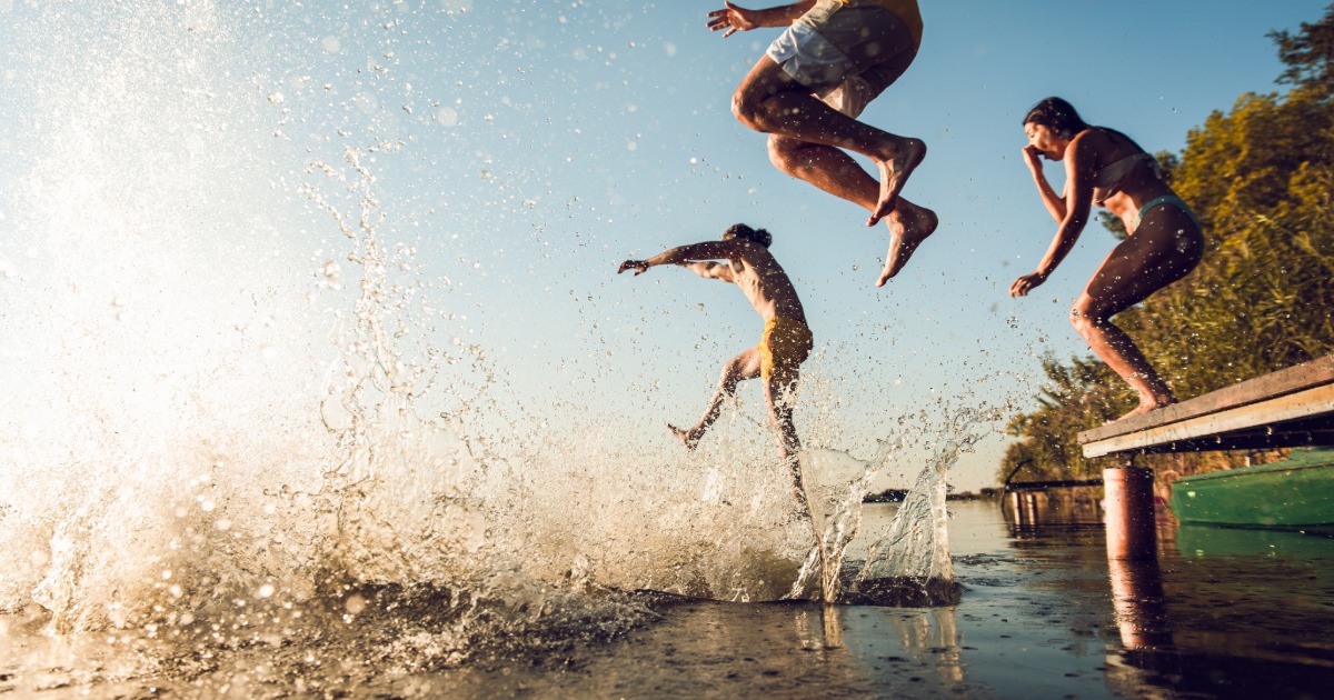 Family relaxing on a lakeside deck at Deep Creek Lake