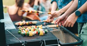 bp-dc-grill | Swack Vacations Family cooking dinner together in a vacation rental kitchen