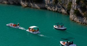 Summer day at Deep Creek Lake with boats and families swimming