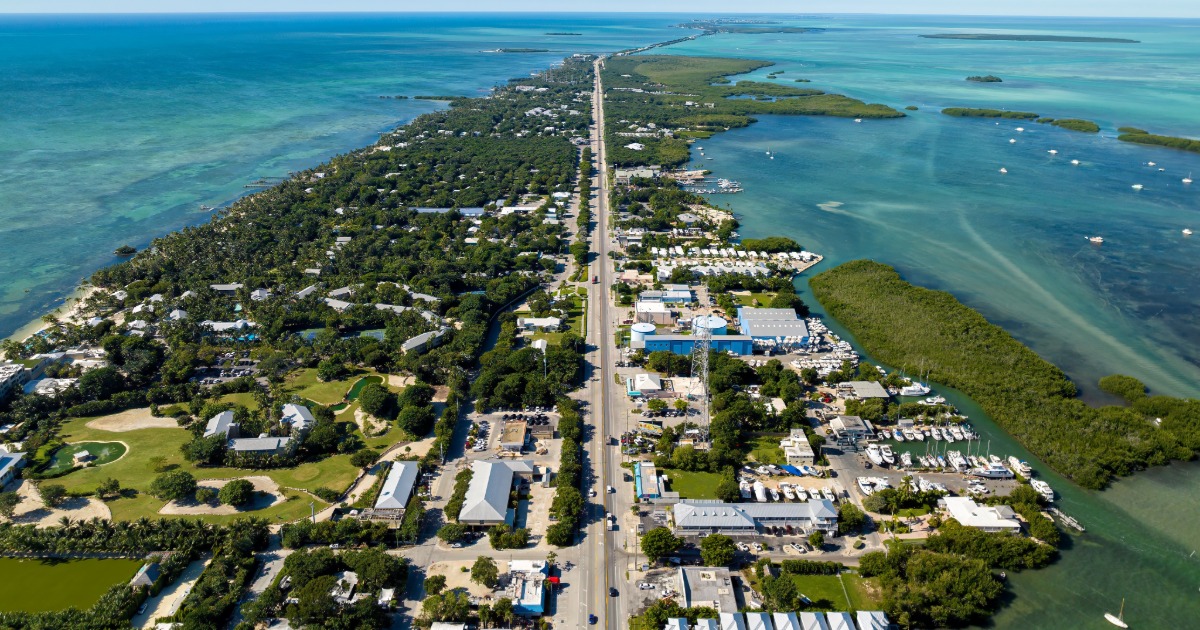 Driving into Key Largo on the Overseas Highway with ocean views in the Florida Keys