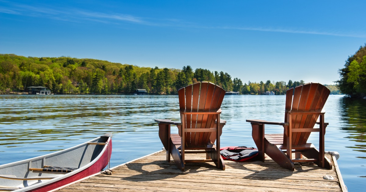 Couple confidently booking a vacation rental direct to save money on their trip