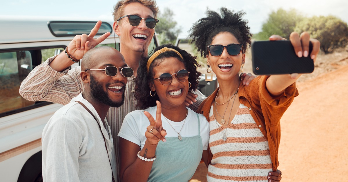 Group relaxing at a vacation rental with different activities happening at once