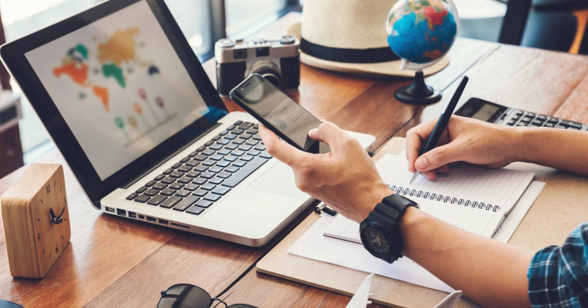 Traveler reviewing vacation rental listing details on a laptop before booking