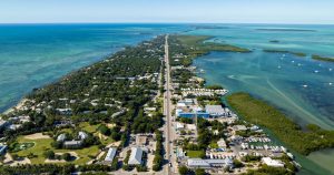 Aerial view of the Florida Keys showing the Overseas Highway surrounded by turquoise water