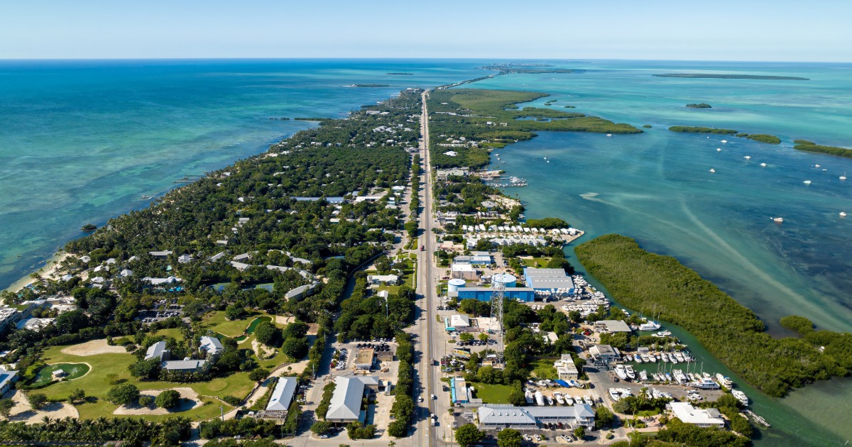 Aerial view of the Florida Keys showing the Overseas Highway surrounded by turquoise water