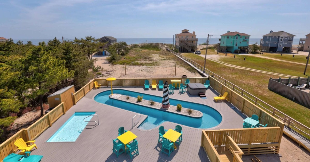 Fenced pool area at a family-friendly vacation rental with safety gate for young children