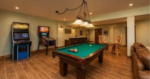Interior of a large mountain vacation home at Deep Creek Lake with vaulted ceilings, stone fireplace, and open living area