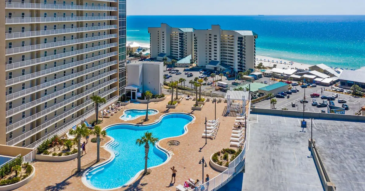 Resort pool deck and lake-view balcony at Laketown Wharf in Panama City Beach