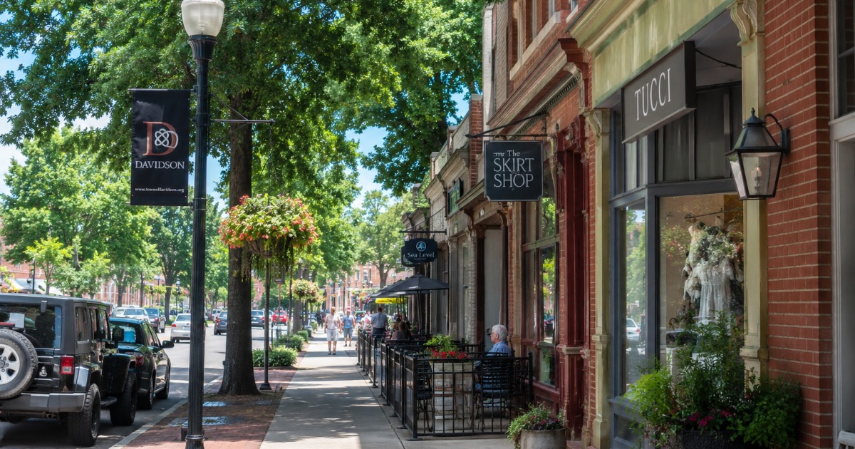 Main street of downtown Davidson NC with shops and trees near Lake Norman