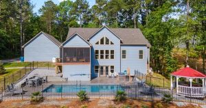 Large lakefront vacation home on Lake Norman with pool, dock, and outdoor entertaining area