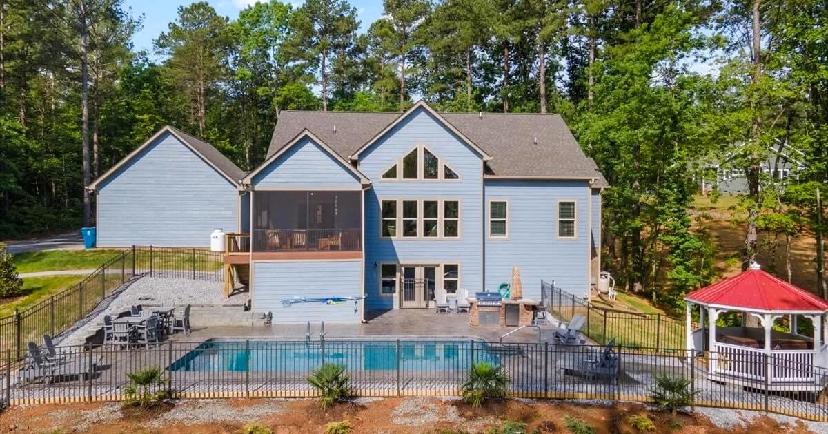 Large lakefront vacation home on Lake Norman with pool, dock, and outdoor entertaining area