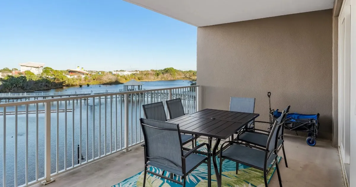 Spacious condo balcony with lake and resort views at Laketown Wharf