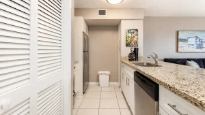 Fully equipped kitchen with granite counters and full-size appliances, ready for family breakfasts before a day on the water.