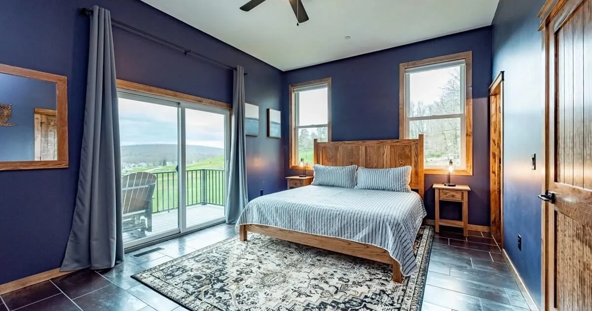 Bedroom with a king bed and private ensuite bathroom in a group vacation rental