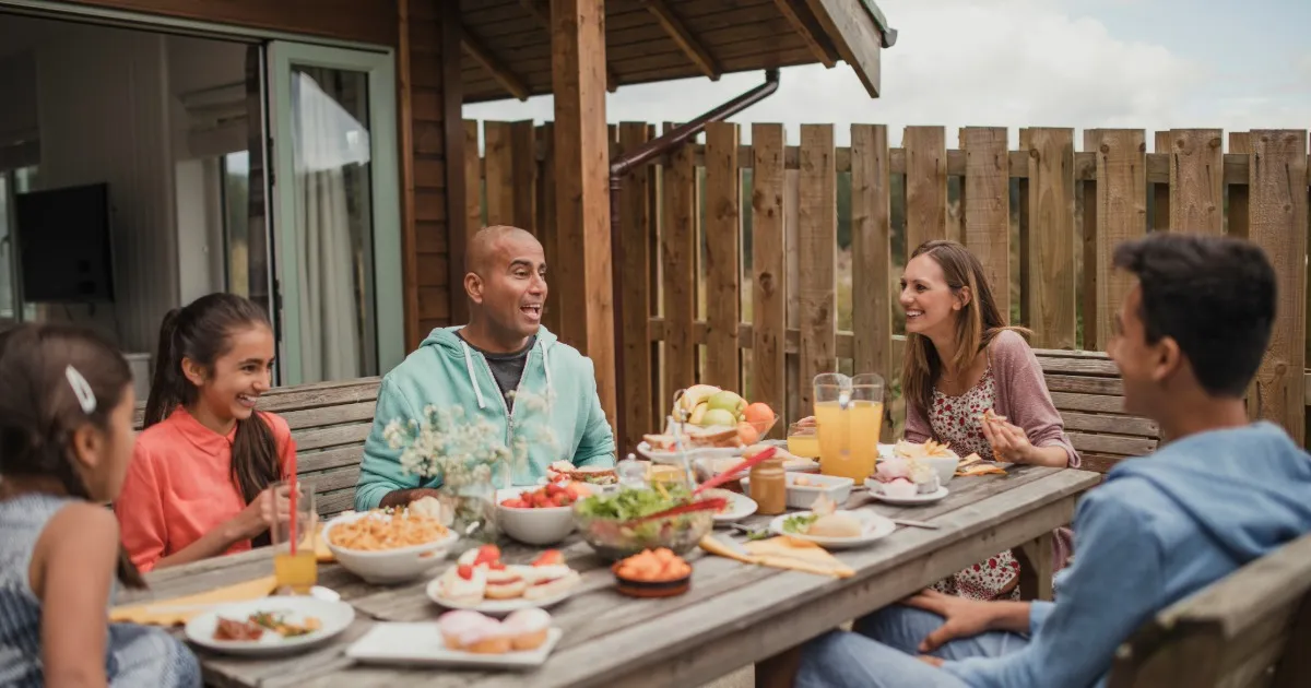 Extended family gathered on the deck of a Swack Vacations rental home