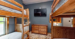 Bunk room with two bunk sets in a large family vacation home