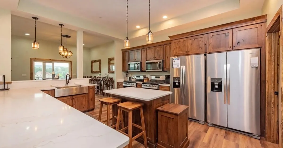 Fully equipped kitchen in a family vacation rental with high chair and children's dishes
