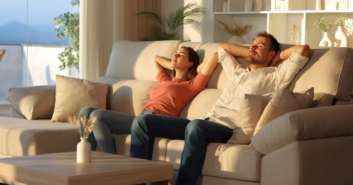 Multi-generational family relaxing together in a spacious vacation rental living room