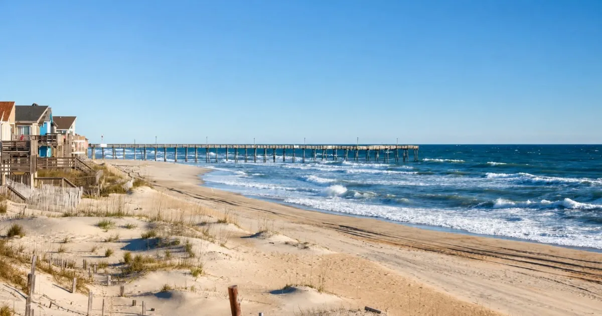 Quiet Outer Banks beach with gentle surf and a soft autumn sky
