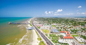 texas-travel-guide | Swack Vacations Elevated stilt beach homes lining a quiet street in Jamaica Beach, TX on Galveston Island
