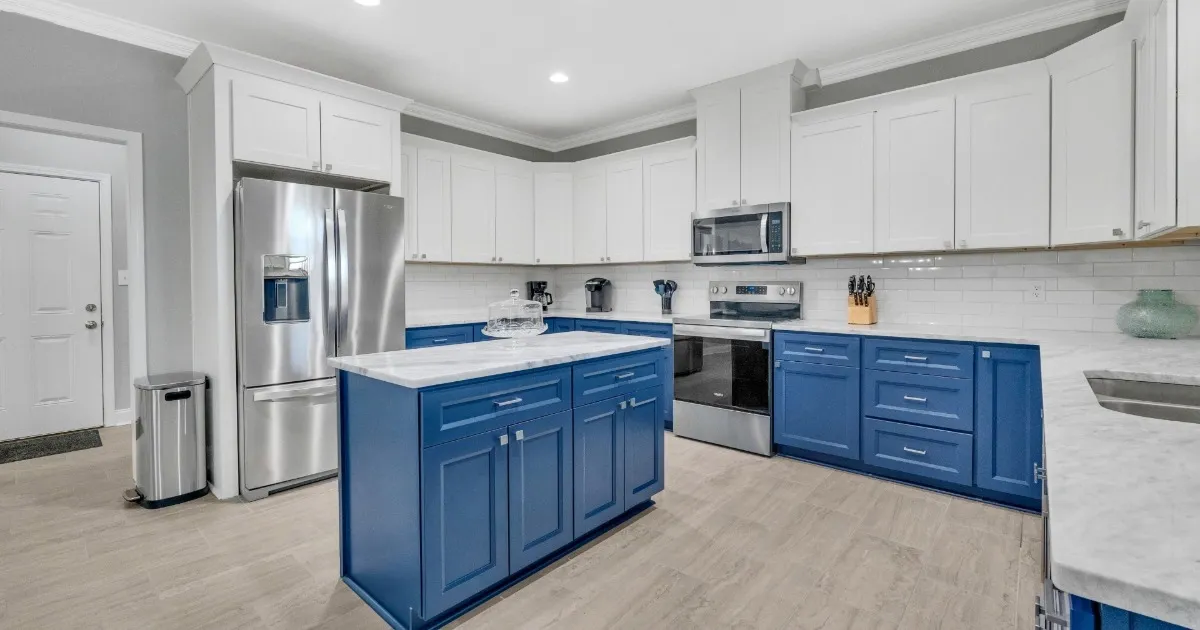 Spacious vacation home kitchen with generous counter space and multiple cooks preparing a meal