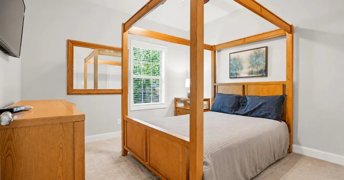 Comfortable ensuite bedroom with a king bed in a large group vacation rental