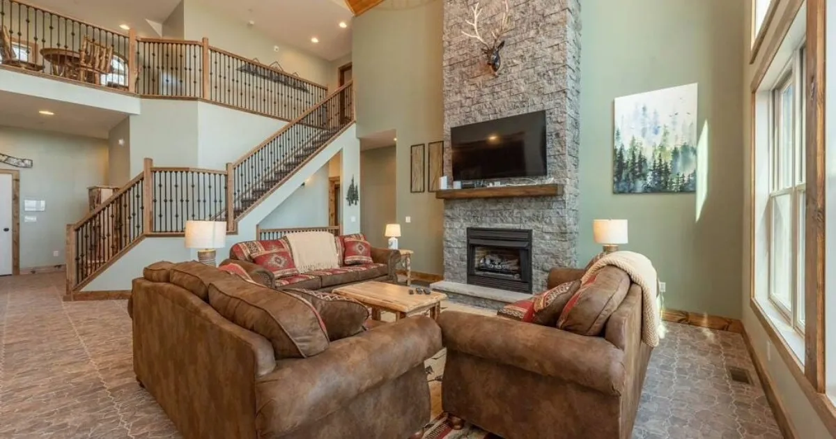 Open-plan living area with multiple seating areas in a large vacation home