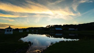 Waterfront Greens Community fishing pond at dusk
