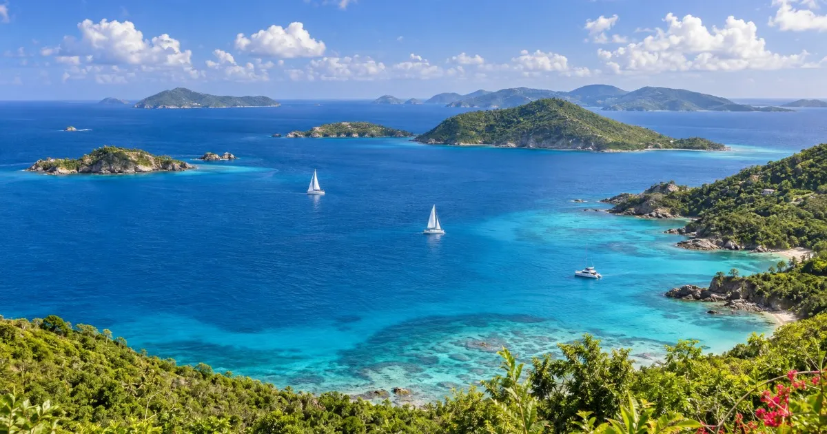 Turquoise water and green hillsides along the St. Thomas East End coastline, a launch point for Caribbean island hopping